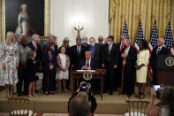 President Donald Trump signs the H.R. 1957 – "The Great American Outdoors Act," in the East Room of the White House, Tuesday, Aug. 4, 2020, in Washington. (AP Photo/Alex Brandon)