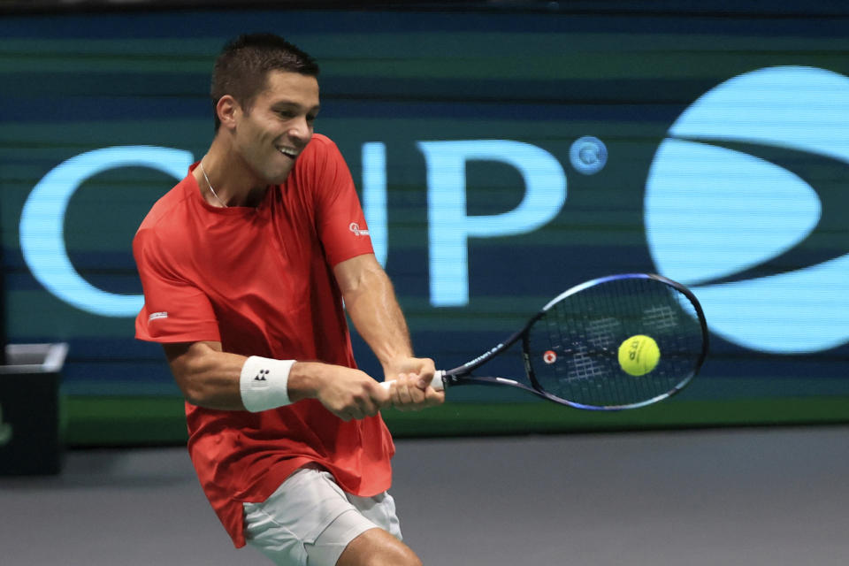 Canada's Alexis Galarneau returns the ball to Chile's Alejandro Tabilo during the men's single Davis Cup group A tennis match between Chile and Canada, in Bologna, Saturday Sept. 16, 2023. (Michele Nucci/LaPresse via AP)