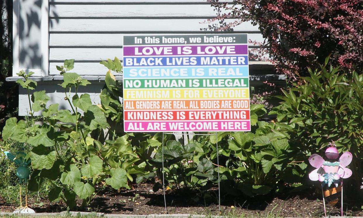 A sign in a yard listing many virtues – an example of virtue signaling. <a href="https://www.gettyimages.com/detail/photo/modern-sign-in-a-front-yard-royalty-free-image/1262002387?adppopup=true" rel="nofollow noopener" target="_blank" data-ylk="slk:davelogan/iStock via Getty images;elm:context_link;itc:0;sec:content-canvas" class="link ">davelogan/iStock via Getty images</a>