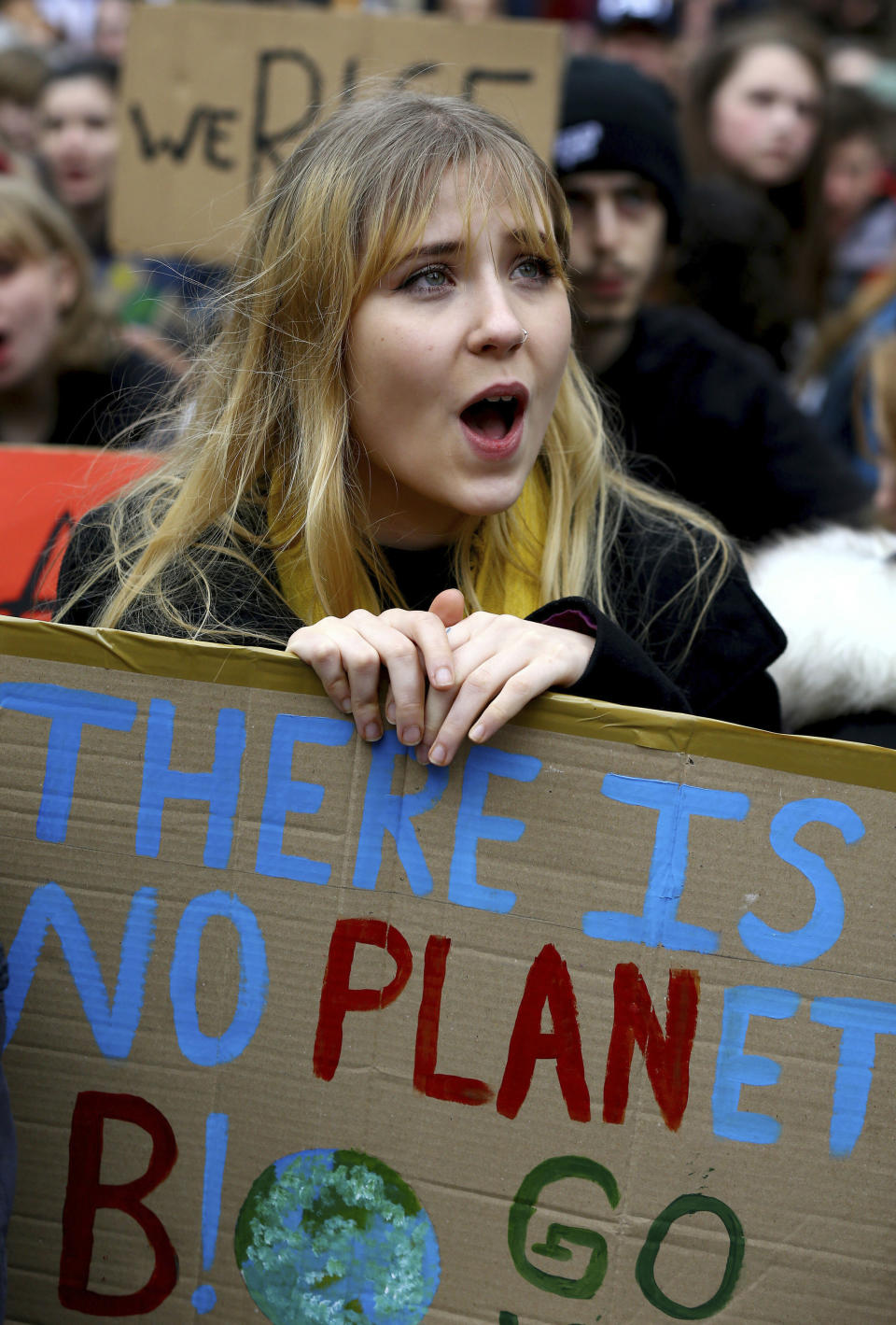 A young student takes part in a global school strike for climate change in Canterbury, south east England, Friday March 15, 2019. Students mobilized by word of mouth and social media skipped class Friday to protest what they believe are their governments’ failure to take though action against global warming. (Gareth Fuller/PA via AP)
