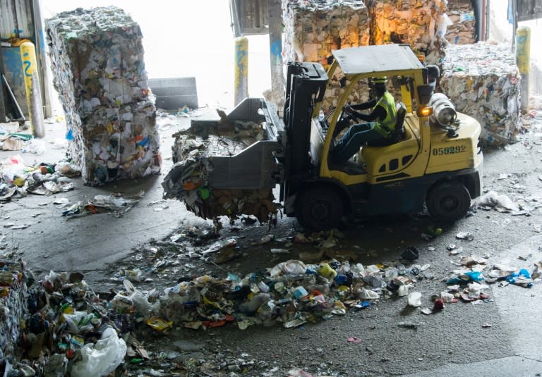 At a recycling facility in the Baltimore-Washington area, bales of compacted plastics and paper are cluttering the plant because China is not buying it as they once did