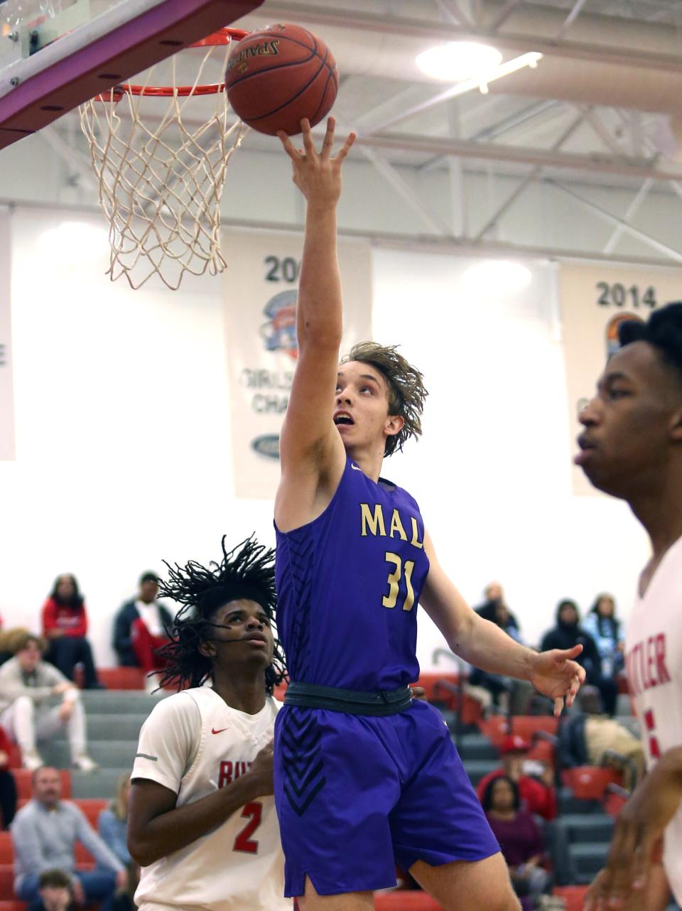 Male’s Jayson Gasaway gets fouled trying to make the shot  against Butler’s Dayton Williams.
Jan. 10, 2023