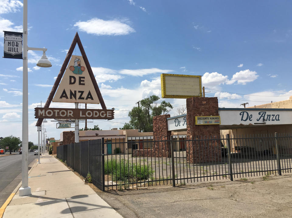 FILE - In this June 24, 2016, file photo, the closed De Anza Motor Lodge sits along Route 66 in Albuquerque, N.M., and recently has been highlighted as one of the few places that allowed black travelers to stay during segregated times. " The Oscar-nominated interracial road trip movie "Green Book" has spurred interest in the 20th Century guidebook that helped black travelers navigate segregated America. (AP Photo/Russell Contreras, File)