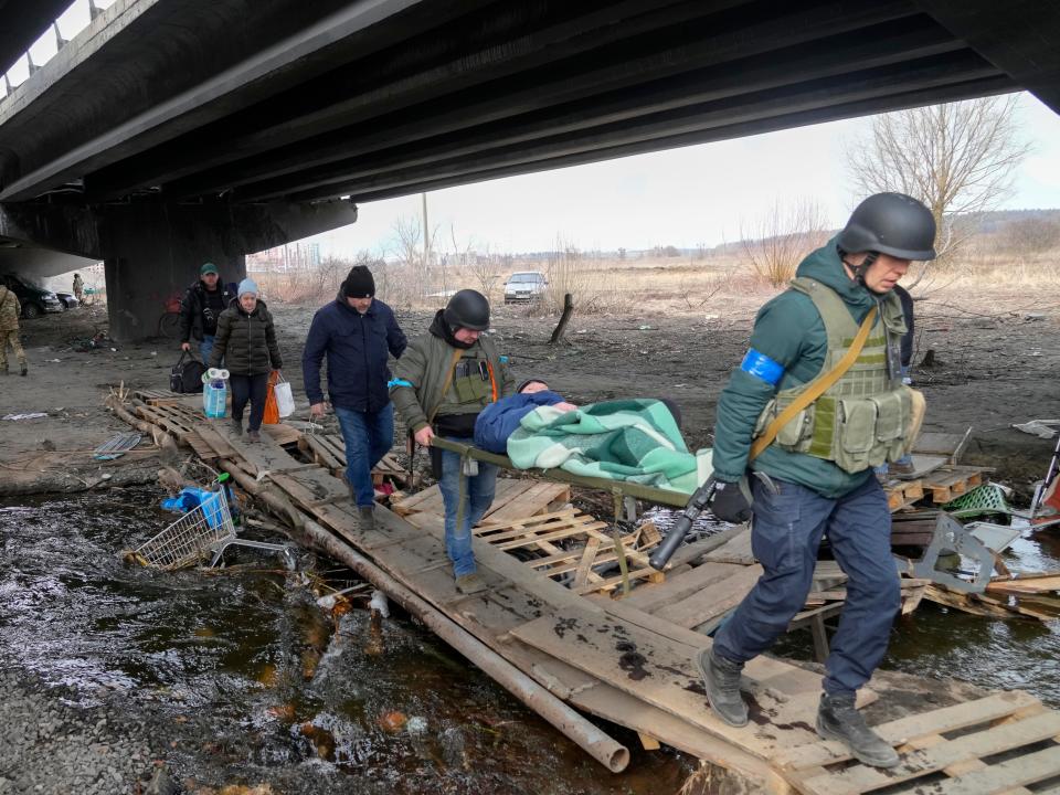 An elderly resident is evacuated in Irpin, Ukraine.