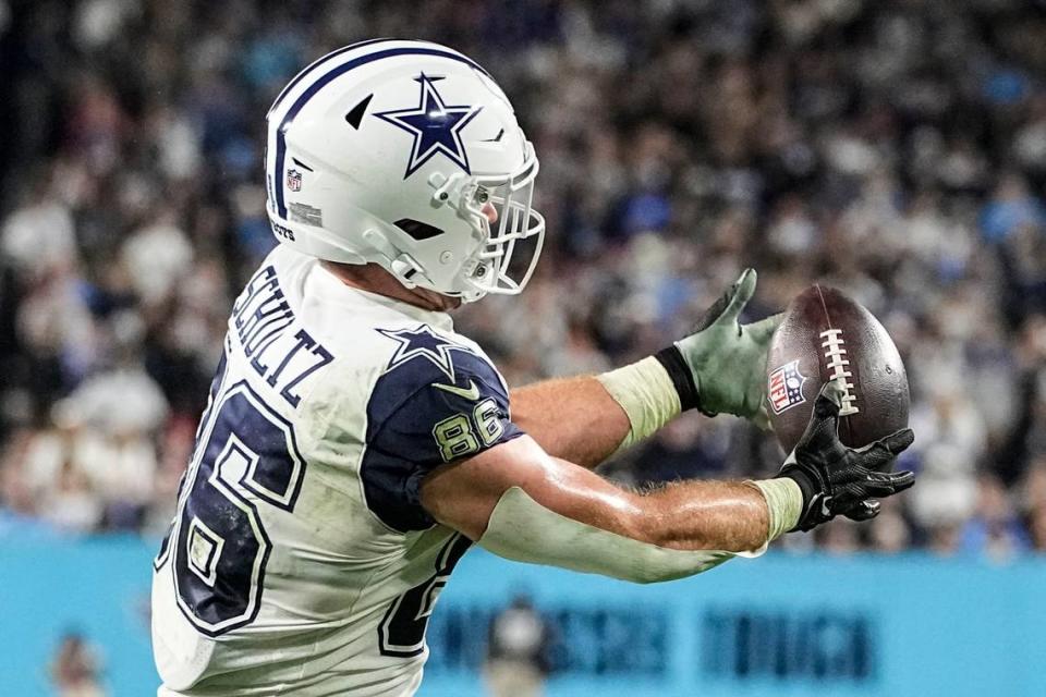 Dallas Cowboys tight end Dalton Schultz (86) makes a catch against Tennessee Titans cornerback Tre Avery (30) during the second half of an NFL football game, Thursday, Dec. 29, 2022, in Nashville, Tenn. Schultz scored a touchdown on the play. (AP Photo/Chris Carlson)