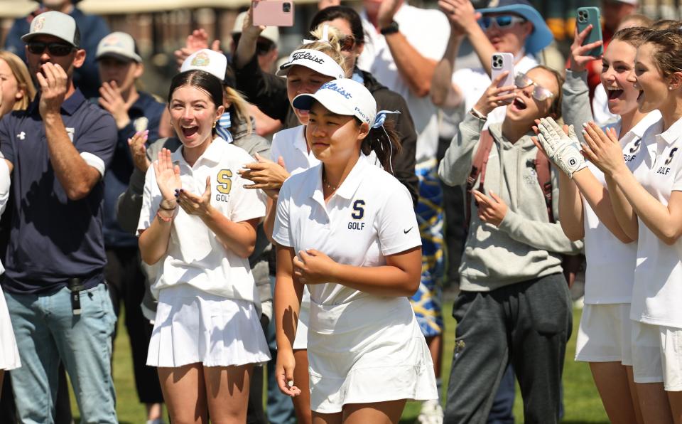 Skyline players cheer as Ashley Lam walks to receive her individual winner medal in the 5A girls high school state championships at Remuda Golf Course in Ogden on Tuesday, May 9, 2023. | Scott G Winterton, Deseret News