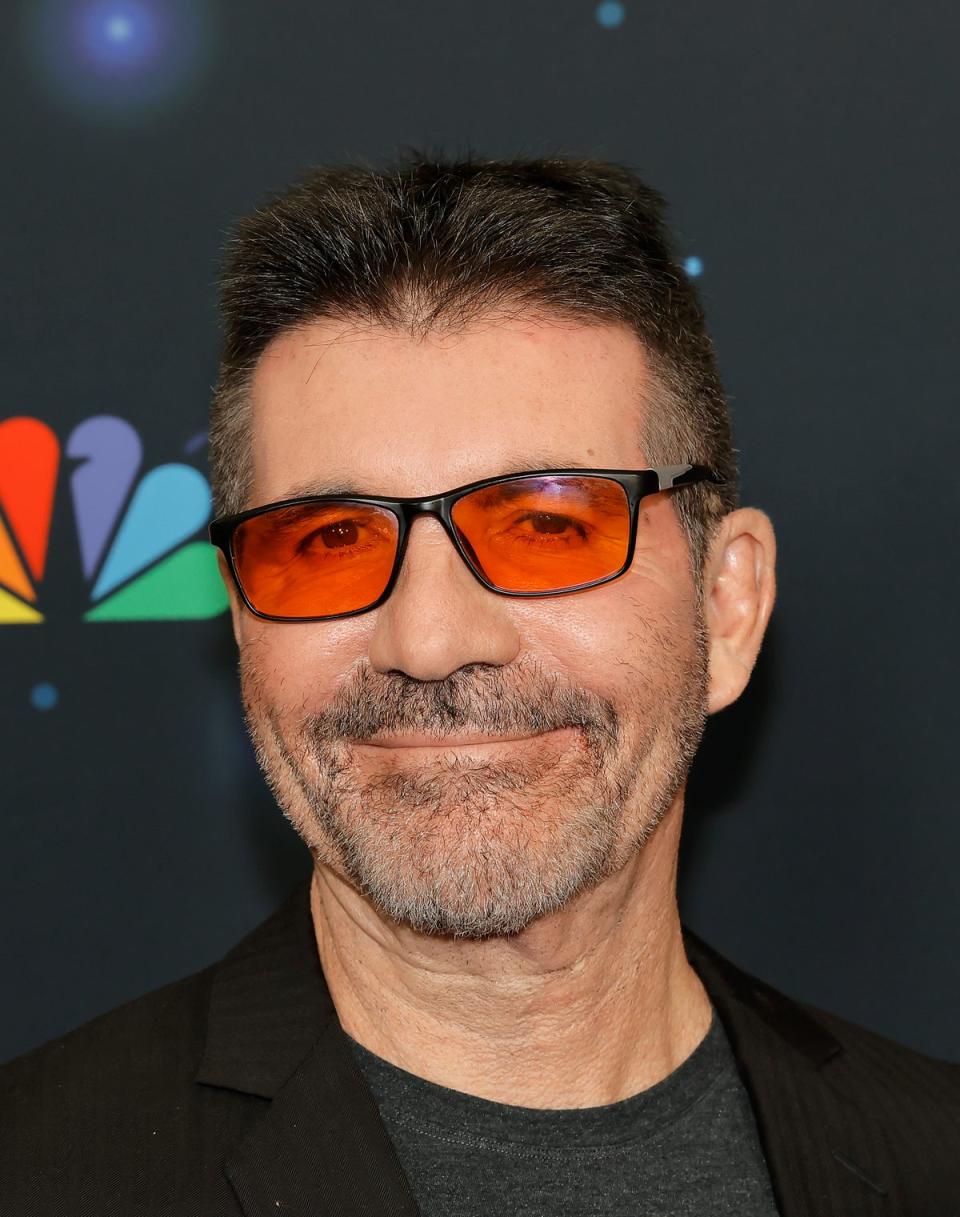 Cowell pictured wearing his red lens glasses (Getty Images)