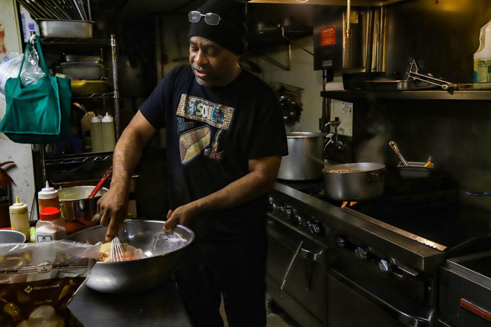 Chef Greg Beard, 62, of Detroit, prepares his famous, 14-ingredient Boogaloo sauce at Chef Greg's Soul "N" the Wall restaurant in northwest Detroit, on Wednesday, April 3, 2024. Chef Greg Beard now has an opportunity to share the Boogaloo with the world, as he has been selected to be an official food vendor at the upcoming NFL draft in Detroit.