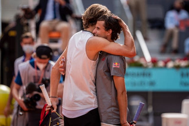 Alexander Zverev (left) embraces Austria’s Dominic Thiem after winning their semi-final clash in Madrid