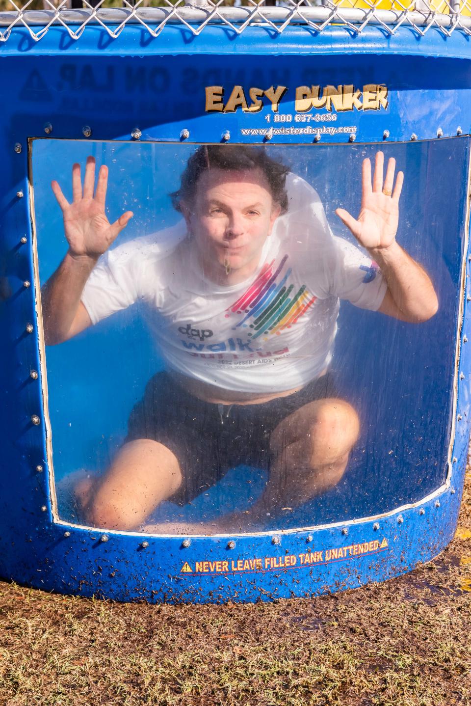 DAP Health CEO makes a splash for LGBTQ+ health equity in the Desert AIDS Walk dunk tank at the Desert AIDS Walk on Oct. 29, 2022.