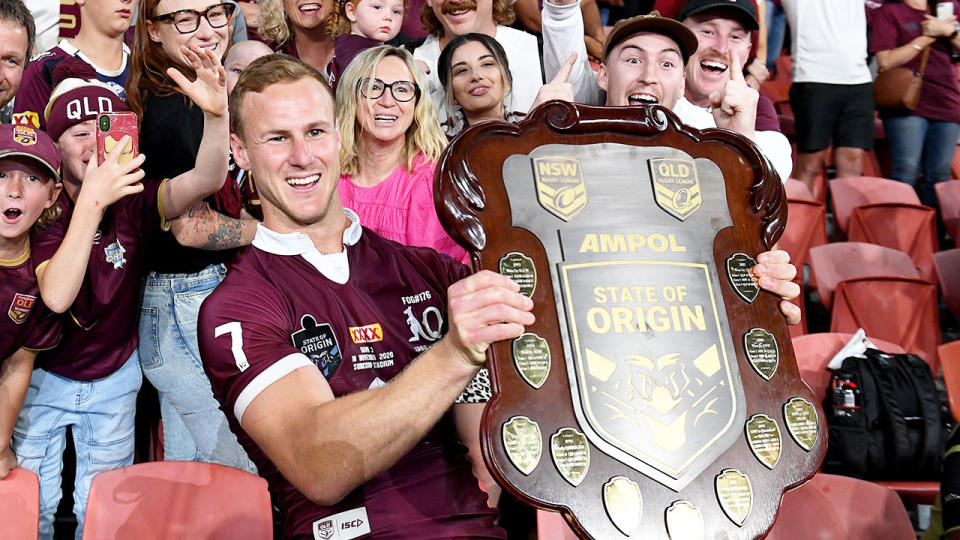 Pictured here, Queensland captain Daly Cherry-Evans holds the State of Origin shield.