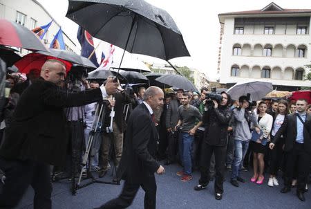 Leader of the biggest opposition party Democratic League of Kosovo (LDK) Isa Mustafa walks to the podium at an election rally in the western Kosovo town of Peja June 1, 2014. REUTERS/Hazir Reka