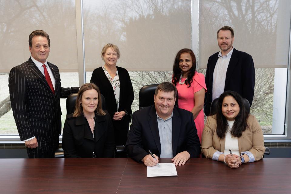 Benito Vattelana (left), Washington County administrators, and Landon's Project community partners including Meritus Health sign a memorandum of understanding for the program.