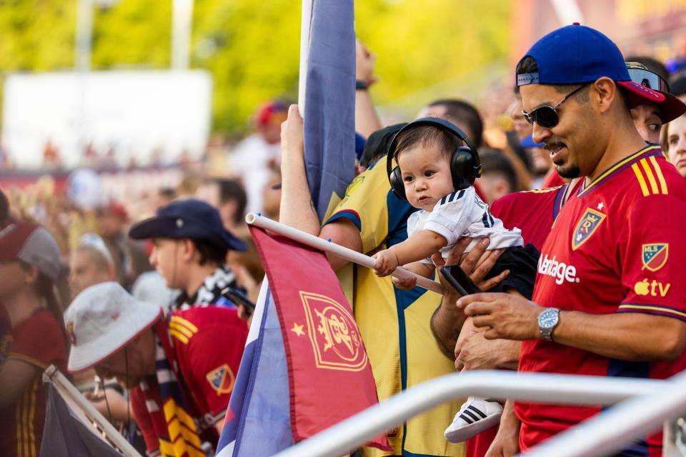 A young Real Salt Lake fan waves a flag during the Real Salt Lake vs. Orlando City soccer match at the America First Field in Sandy on Saturday, July 8, 2023. RSL won the game 4-0. | Megan Nielsen, Deseret News