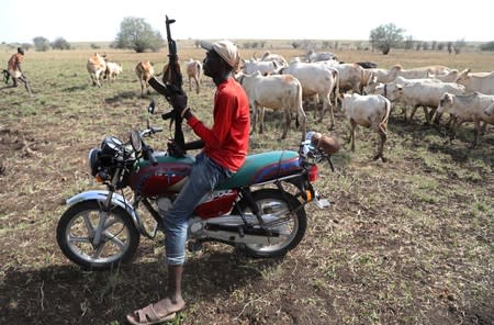 The Wider Image: When raiders menace in northern Kenya, grab your guns