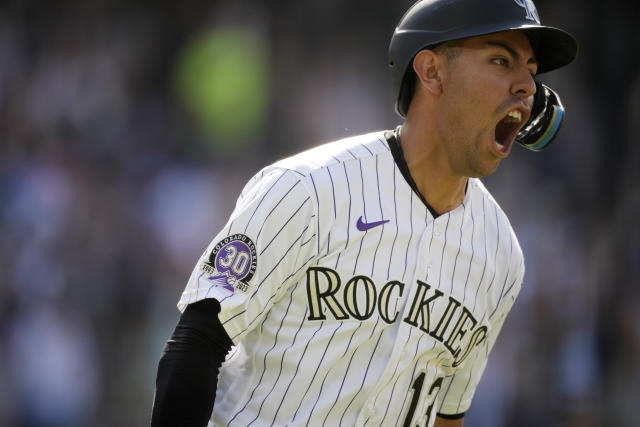 Colorado Rockies' C.J. Cron (25) reacts before the start of a