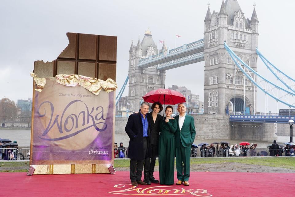 Hugh Grant, Timothee Chalamet, Olivia Colman and Rowan Atkinson during a photo call with the cast of Wonka in London. (PA)