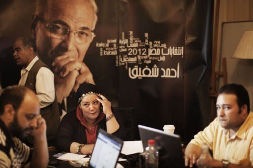 Egyptian campaign managers for presidential candidate Ahmed Shafiq work at his campaign headquarters in Cairo. Egypt looks set for a run-off presidential vote between the Muslim Brotherhood's Mohammed Mursi and Shafiq, pitting the Islamists who helped oust a dictator against his last premier