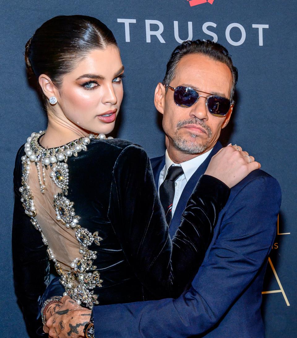 Nadia Ferreira and Marc Anthony hugging on the red carpet