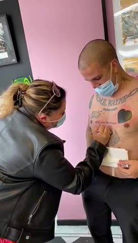 Man with more than 20 tattoos adds to his collection as he pops the question to his girlfriend with tattoo that reads "Will you marry me?" - complete with 'Yes/No' tick-boxes