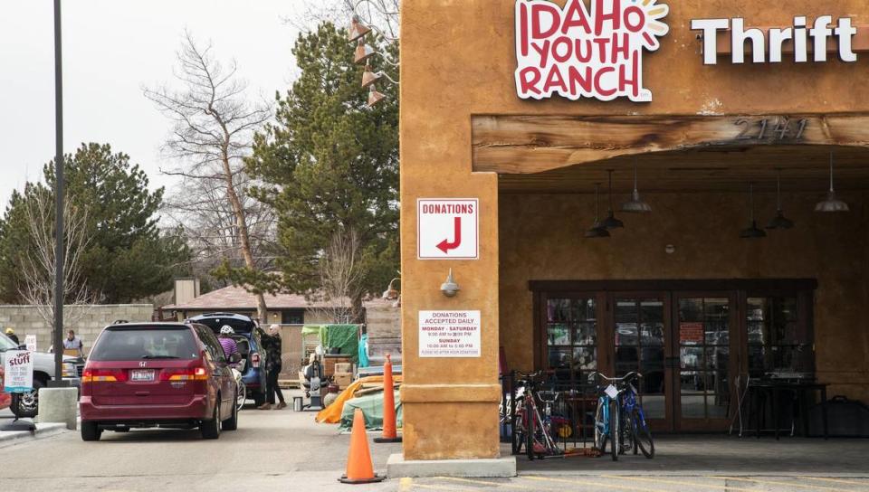 A line of cars forms with people dropping off donations at Idaho Youth Ranch’s Broadway Avenue store in Boise, on a Saturday afternoon in February.