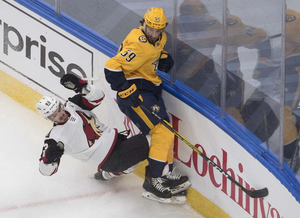 FILE - In this Aug. 2, 2020, file photo, Nashville Predators' Roman Josi (59) checks Arizona Coyotes' Conor Garland (83) during first-period NHL hockey qualifying round game action in Edmonton, Alberta. Josi has won the Norris Trophy as the best defenseman. (Jason Franson/The Canadian Press via AP, File)