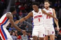 Nov 25, 2018; Detroit, MI, USA; Detroit Pistons forward Stanley Johnson (7) celebrates with guard Reggie Jackson (1) and forward Blake Griffin (23) during the fourth quarter against the Phoenix Suns at Little Caesars Arena. Mandatory Credit: Raj Mehta-USA TODAY Sports