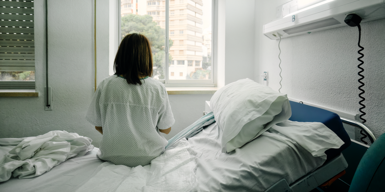 a person sitting on a bed