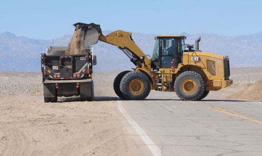 Tractors move debris in preparation for Death Valley’s reopening in mid-October. (Photo: S.Poster/National Park Service)