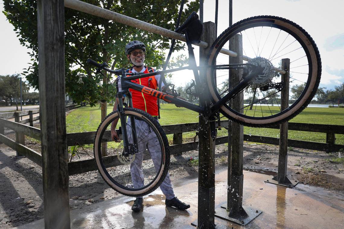 Alfred Leon, 33, washes his bike after mountain biking at Amelia Earhart Park on Dec. 21, 2022.