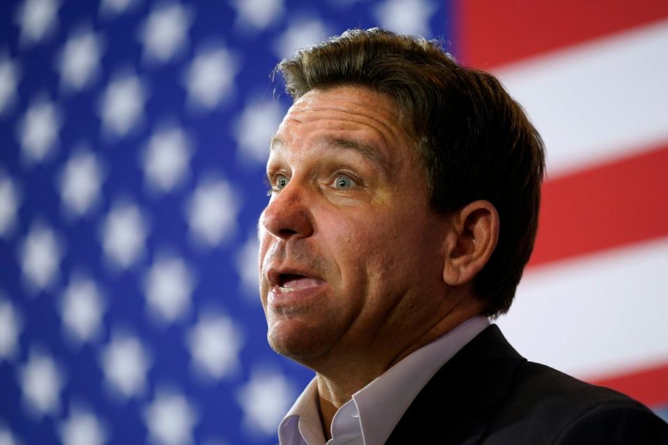 Republican presidential candidate Florida Gov. Ron DeSantis speaks to the media after a meet and greet on 7 December (AP)
