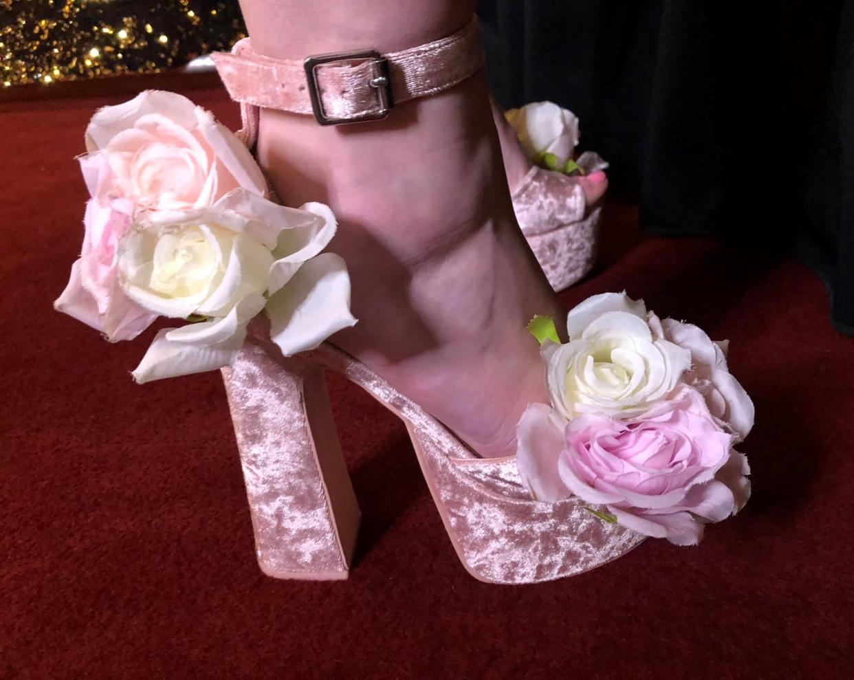 Helena Levin aka California Barbie Princess wears high heels while being her friends' flower girl during their wedding at The City Club of San Francisco on July 16, 2022.