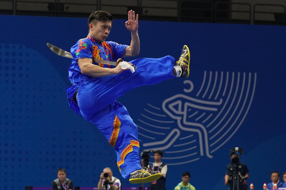 Singapore's Jowen Lim in action in the men’s daoshu and gunshu all-round event, as he clinches a silver medal at the 2023 Hangzhou Asian Games. (PHOTO: Sport Singapore/ Bryan Foo)