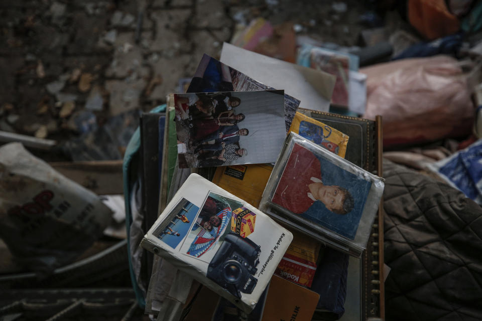 Residents' belongings can been seem in the rubble of collapsed buildings in the coastal city of Izmir, Turkey, Monday, Nov. 2, 2020. In scenes that captured Turkey's emotional roller-coaster after a deadly earthquake, rescue workers dug two girls out alive Monday from the rubble of collapsed apartment buildings three days after the region was jolted by quake that killed scores of people. Close to a thousand people were injured. (AP Photo/Emrah Gurel)