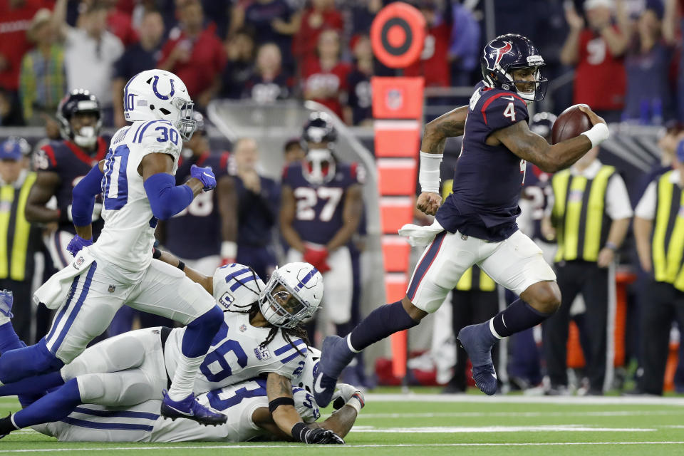 <p>Deshaun Watson #4 of the Houston Texans avoids a tacke by Clayton Geathers #26 of the Indianapolis Colts and Darius Leonard #53 in the fourth quarter during the Wild Card Round at NRG Stadium on January 5, 2019 in Houston, Texas. (Photo by Tim Warner/Getty Images) </p>