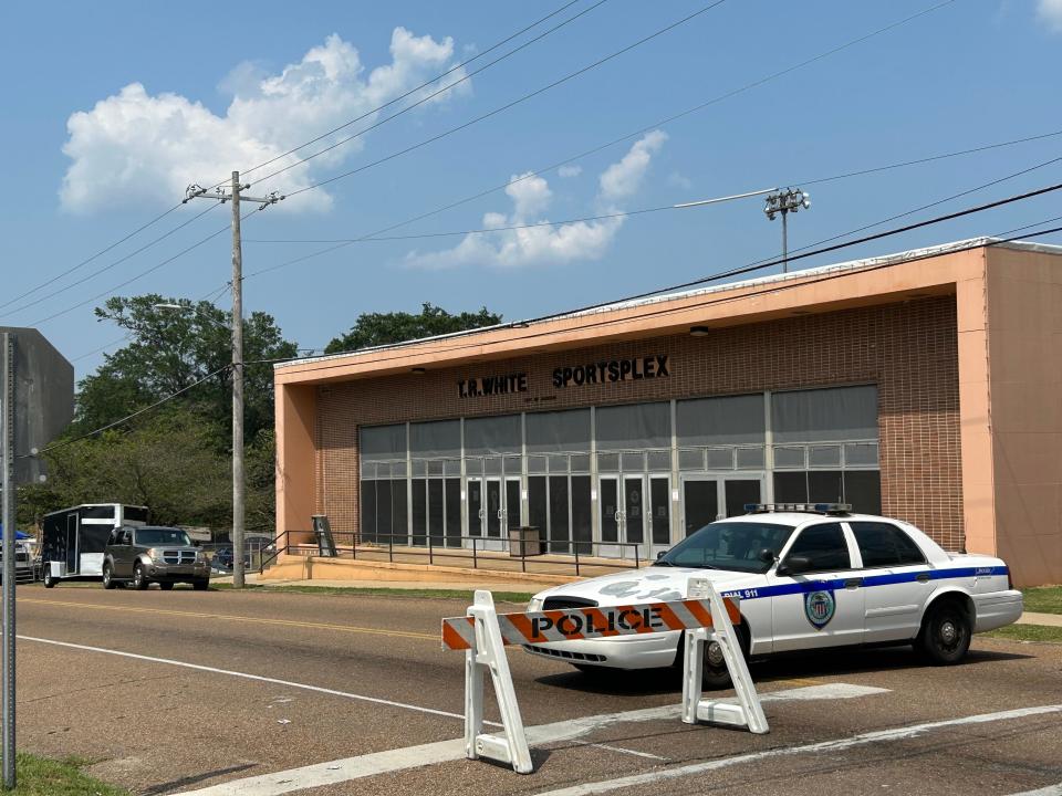 A police car stays at the entrance of a blocked off street in front of the T.R. White Sportsplex for the Juneteenth celebration in Jackson, Tenn. on June 18, 2023.