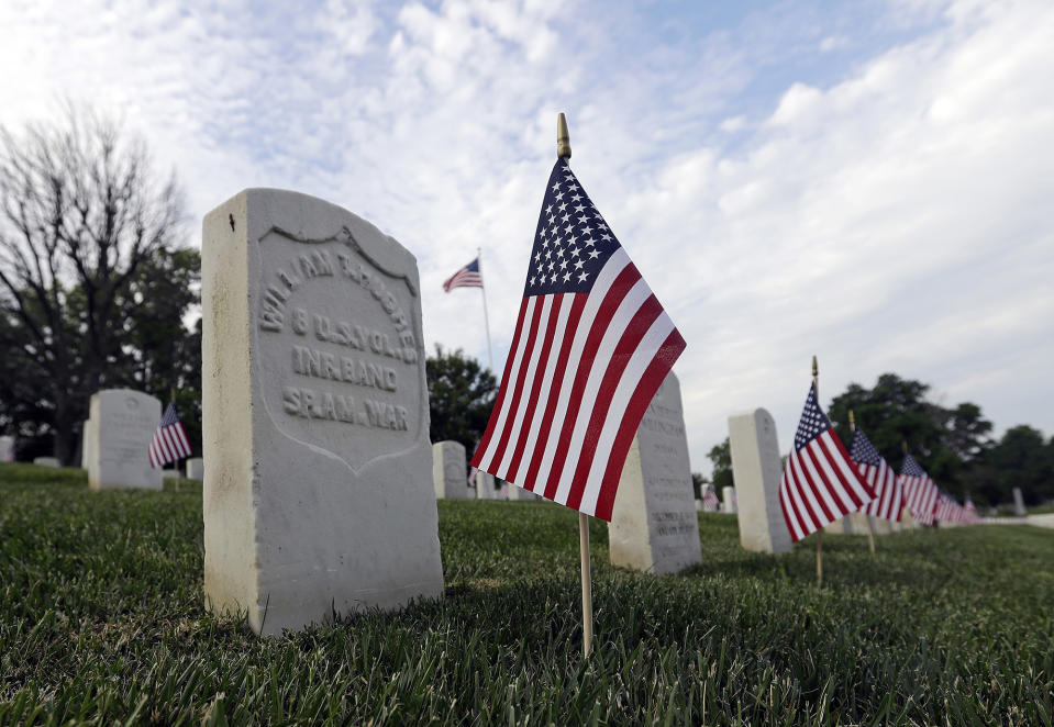 <p>American flags fly next to veterans’ graves ahead of Memorial Day at the Crown Hill National Cemetery, Saturday, May 28, 2016, in Indianapolis. (AP Photo/Darron Cummings) </p>