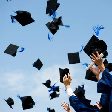 Graduation caps being thrown web