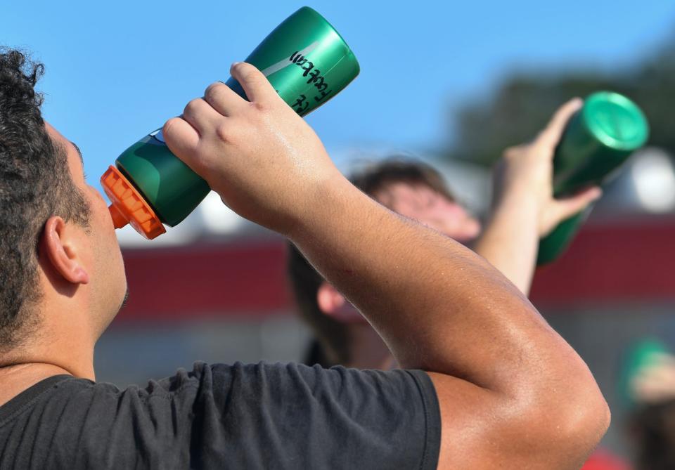 The Palm Bay High School football team practices without pads on Aug. 10, 2023 in Melbourne, Florida. The team plays without pads during extreme heat. Practice was abbreviated because of high heat warnings in the area Wednesday.