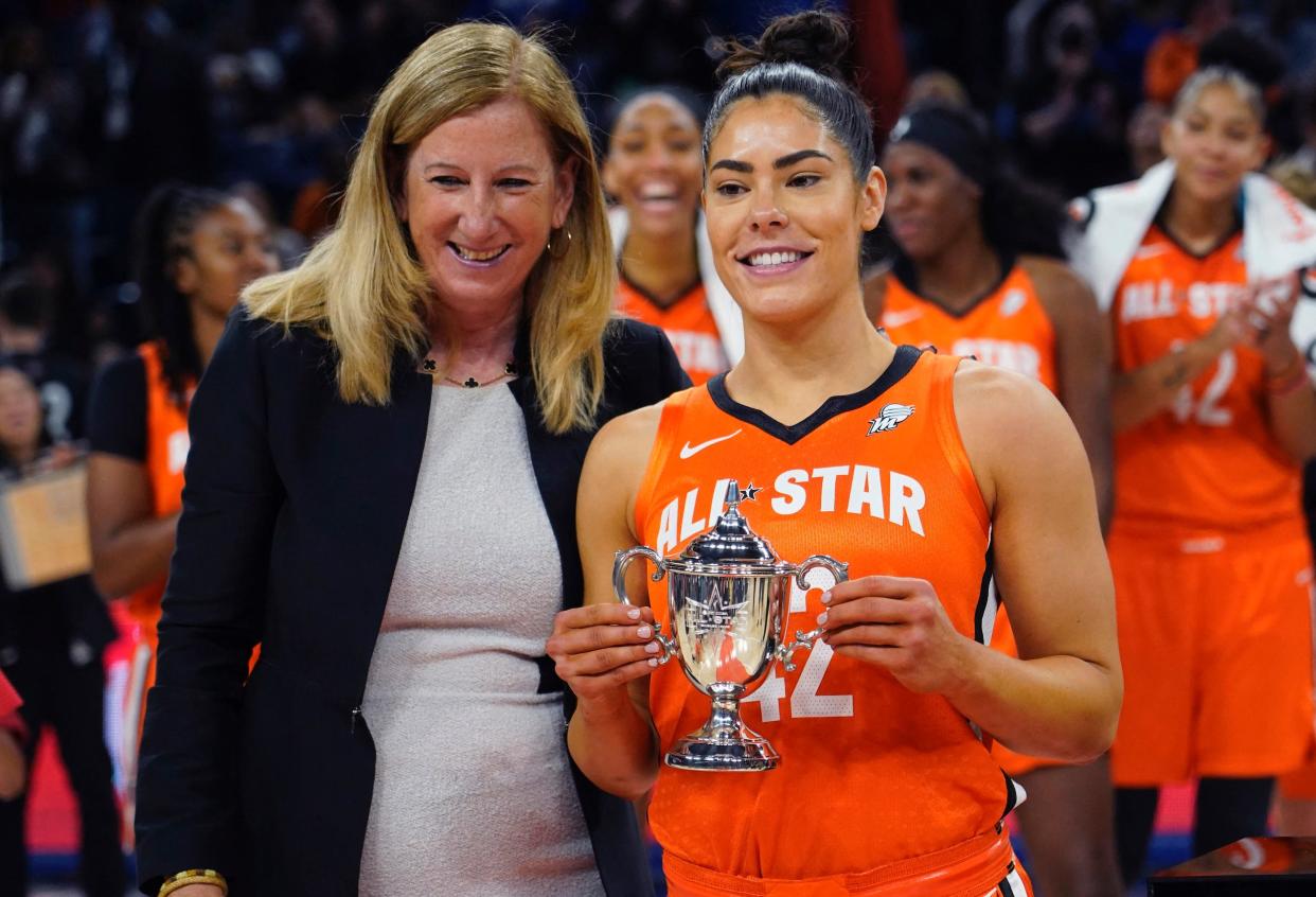 Kelsey Plum (right) poses with her 2022 WNBA All-Star Game MVP trophy.