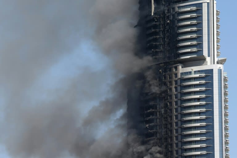 Smoke billows from the Address Downtown Hotel in Dubai on January 1, 2016