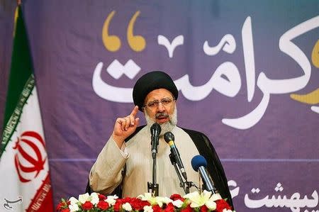 FILE PHOTO: Ebrahim Raisi gestures in this undated handout photo provided by Tasnim News Agency on May 9, 2017. Tasnim News Agency/Handout /File Photo via REUTERS