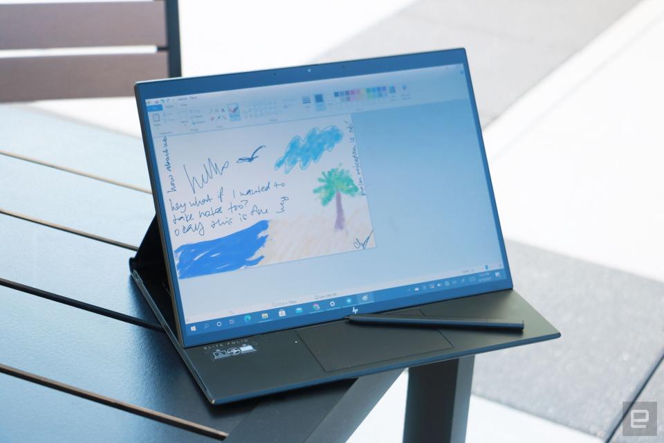 <p>HP Elite Folio Engadget review photo: The convertible set up in easel mode (with the screen pulled forward) showing a Paint sketch of a beach.</p>
