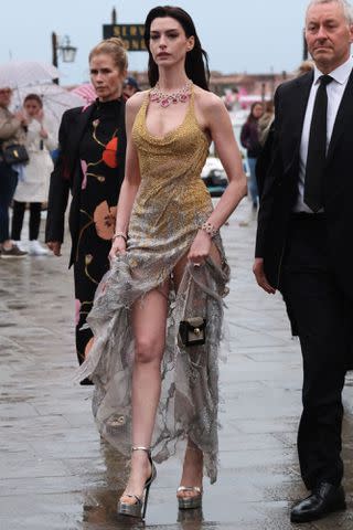 Anne Hathaway wears gold gown on trip to Venice