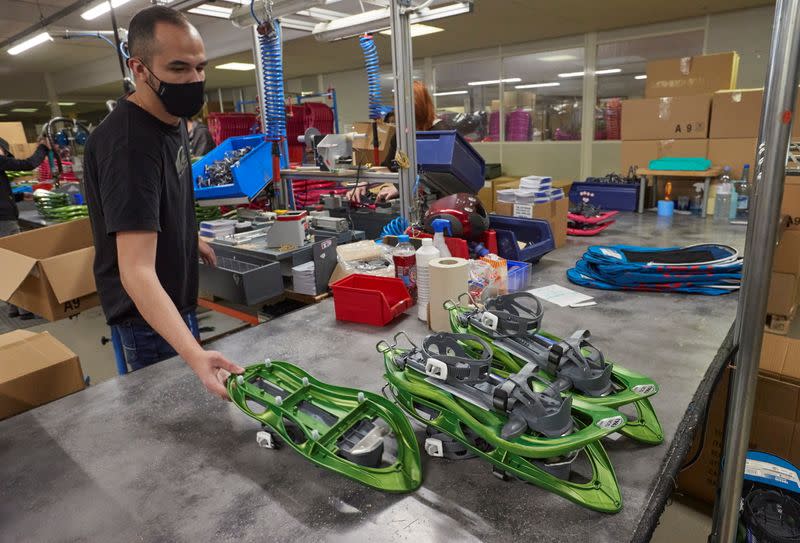 Staff assemble products at world biggest snowshoes maker TSL in Annecy-le-Vieux