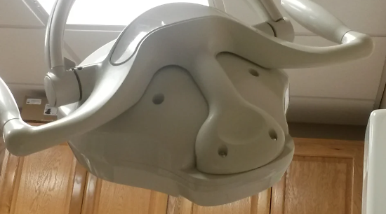 the overhead light machine looks like the face of a buffalo