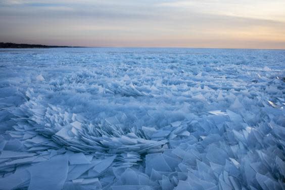 Lake Michigan covered in ice shards in mesmerising new pictures as spring arrives
