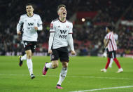 Fulham's Harry Wilson celebrates scoring their side's first goal of the game during the English FA Cup fourth round replay soccer match against Sunderland at the Stadium of Light, Sunderland, England, Wednesday, Feb. 8, 2023. (Owen Humphreys/PA via AP)