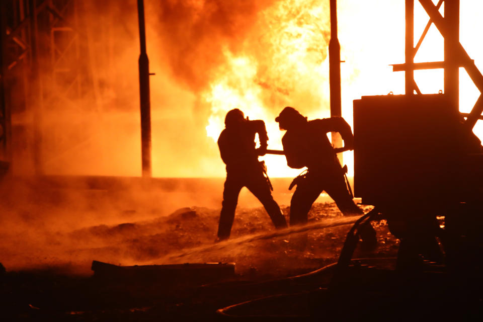 KHARKIV REGION, UKRAINE - SEPTEMBER 11, 2022 - Firefighters of the State Emergency Service (DSNS) work to put out the fire which erupted after a Russian missile attack at the energy facility, Kharkiv Region, northeastern Ukraine. On Sunday evening, Russian invaders launched 11 cruise missiles at critical civilian infrastructures. Seven missiles were intercepted by the Ukrainian military. (Photo credit should read Vyacheslav Madiyevskyy/ Ukrinform/Future Publishing via Getty Images)