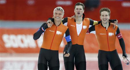 Koen Verweij (L-R) of the Netherlands, Sven Kramer and Jan Blokhuijsen celebrate winning in the men's speed skating team pursuit Gold-medal race at the Adler Arena in the Sochi 2014 Winter Olympic Games February 22, 2014. REUTERS/Phil Noble